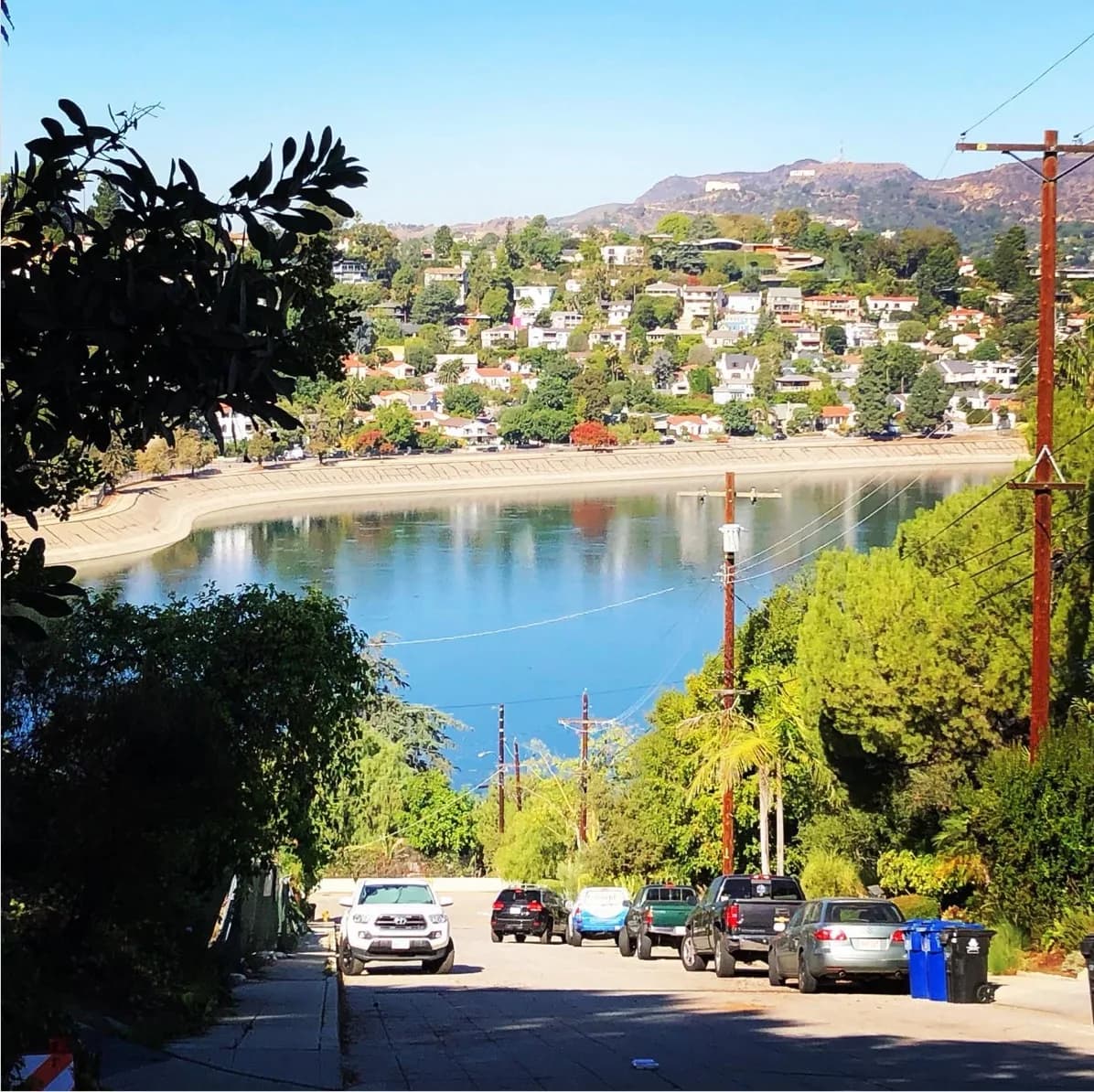 Looking west over the Silver Lake resevoir from Baxter Street with iconic Griffith Park Observatory and the Hollywood Sign in the distance.