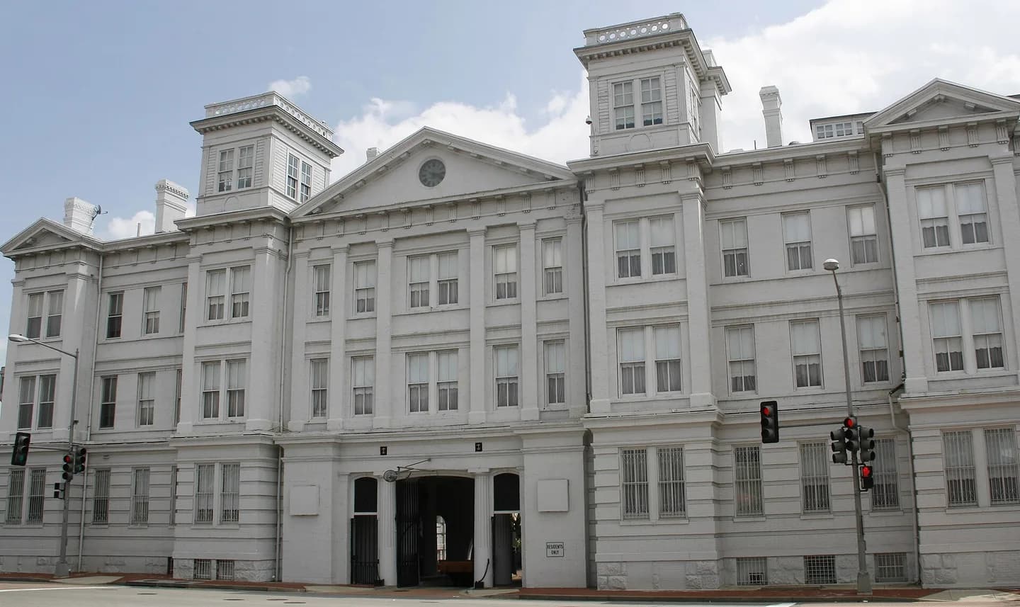 The Main Gate into the Washington Navy Yard lies at the juncture of the Eighth Street axis and M Street in Southeast Washington. It is a Greek Revival structure which has been incorporated into the ground story of a three-story late Victori