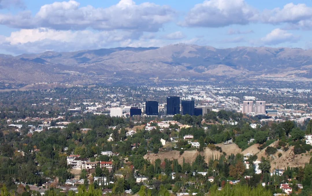 View of the San Fernando Valley, with Woodland Hills and Warner Center in the foreground - viewed from 'Top of Topanga' park area in the Santa Monica Mountains. The Santa Susana Mountains are visible in the background across the valley.
