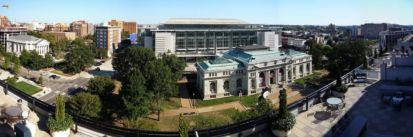 Mount Vernon Square, Washington, D.C.. To the left is Mount Vernon Place United Methodist Church. In the center is a Carnegie library; behind it is the Washington Convention Center; to the right is the recently-razed headquarters of Natio