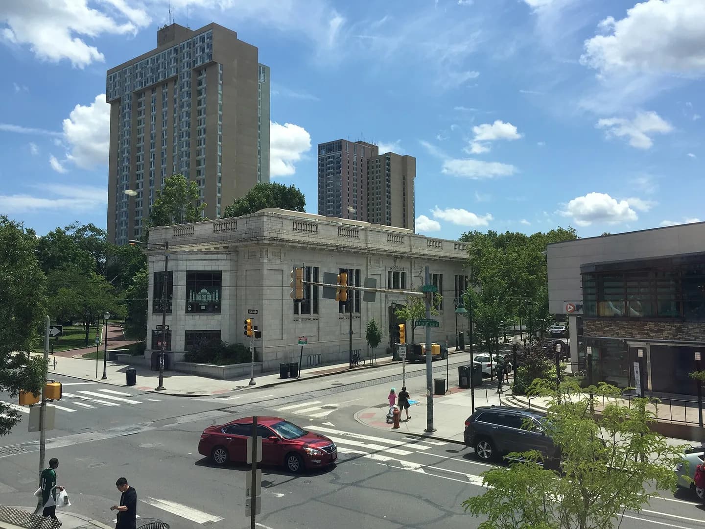 University City 2017. Taken at the intersection of 40th and Walnut Streets, looking southeast. At center is the Walnut Street West branch of the w:Philadelphia Free Library, constructed 1906. In the background are the high-rise dormitori