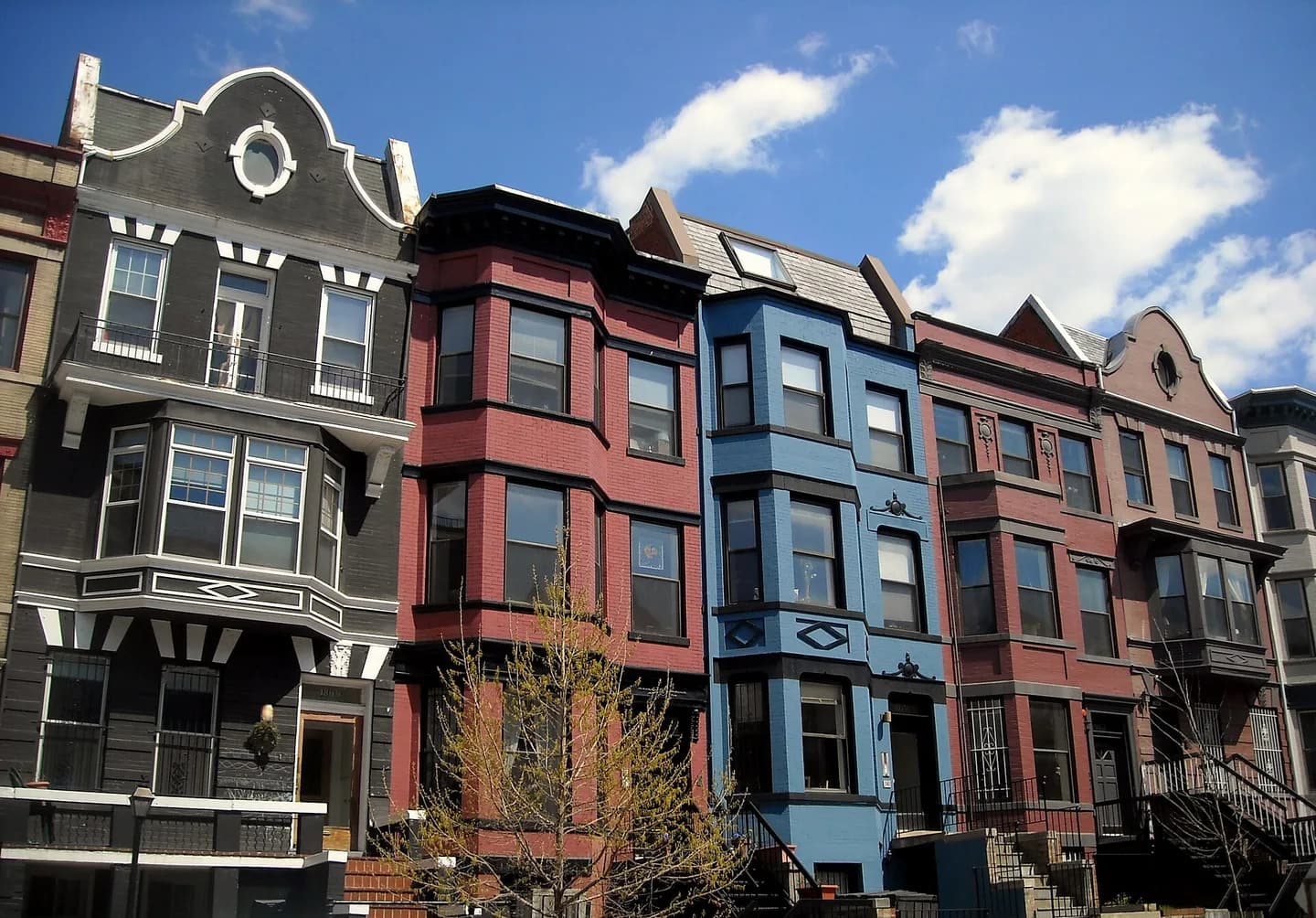 Row houses located at (from right to left) 1861–1869 California Street, N.W., in the Adams Morgan neighborhood of Washington, D.C. Built in 1904, the Queen Anne-style homes are designated as contributing properties to the Washington Height
